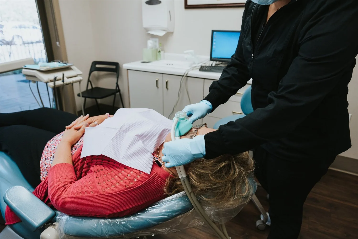 A patient relaxes in the chair during an appointment